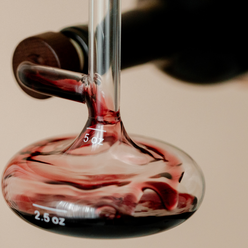 Close up of Savvy Llama on the bottle glass decanter beautifully aerating red wine directly from the bottle. 