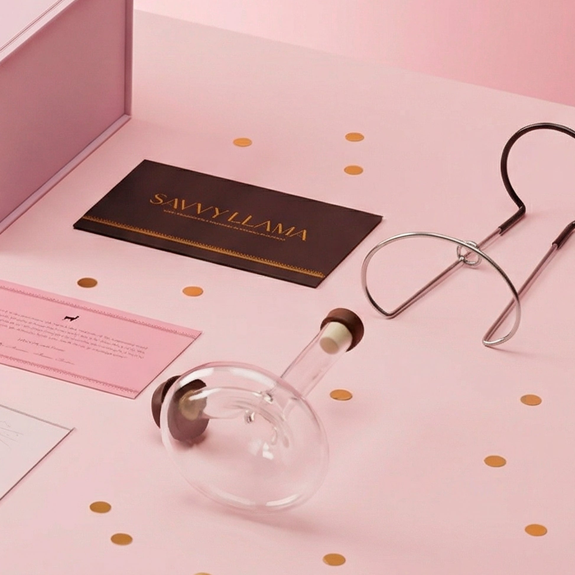 The hand-blown mini decanter from the Savvy Llama wine decanting kit, designed to sit on the bottle and aerate wine as it pours for an effortless at-home wine serving ritual