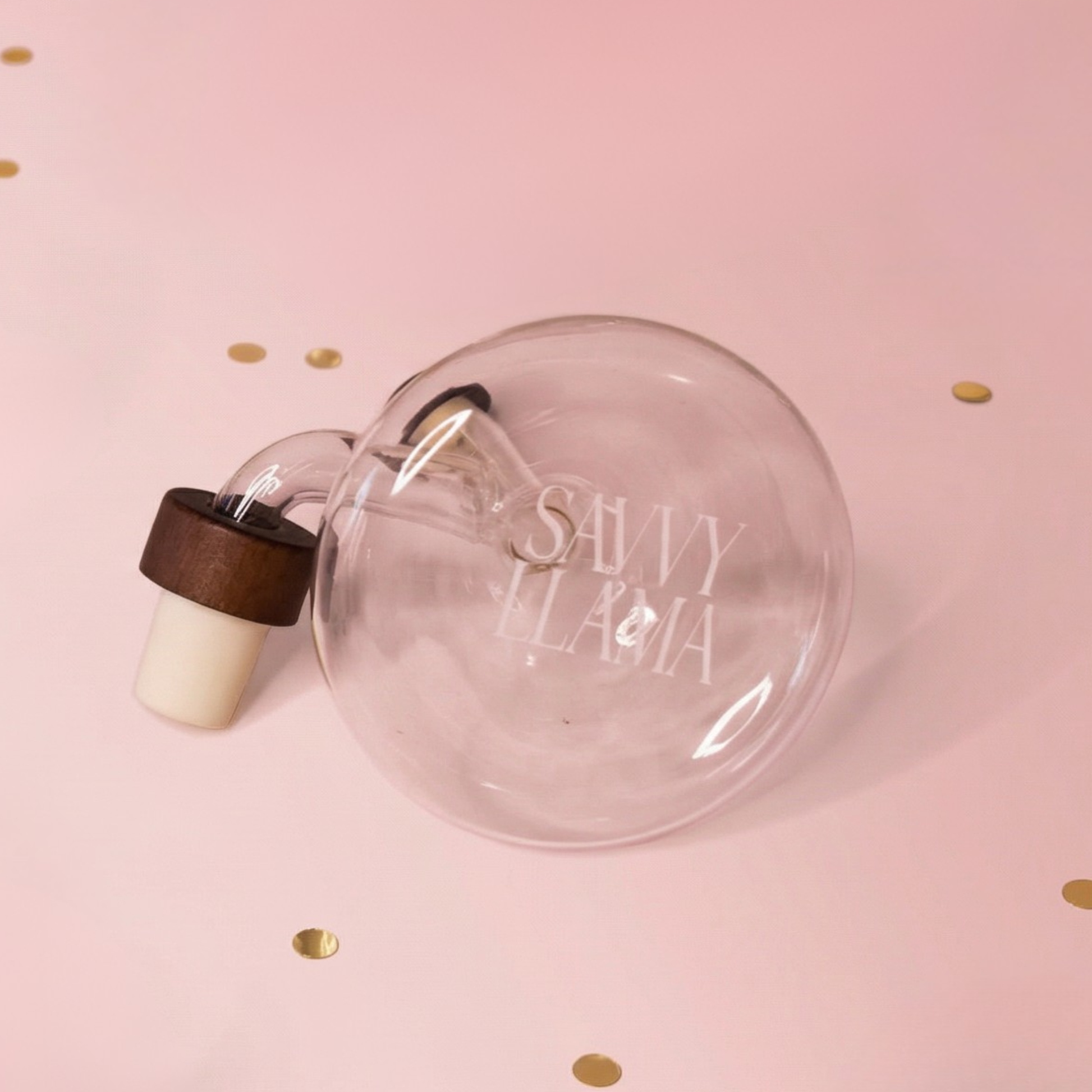Soft pink and gold studio background for the Savvy Llama wine decanter, reflecting the brand's feminine and elevated wine lifestyle aesthetic